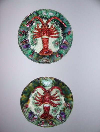 Majolica-Palissy lobster bowls are colorfully painted and hang on the kitchen wall of Lys Marigold's East Hampton home. BRANDI BUCHMAN