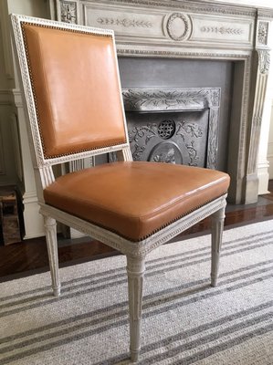A Louis XVI leather chair. MARSHALL WATSON