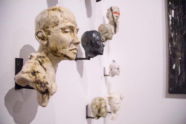 Sculpter Bob Clyatt creates a series of "Untitled" head's in his installation. MAGGY KILROY
