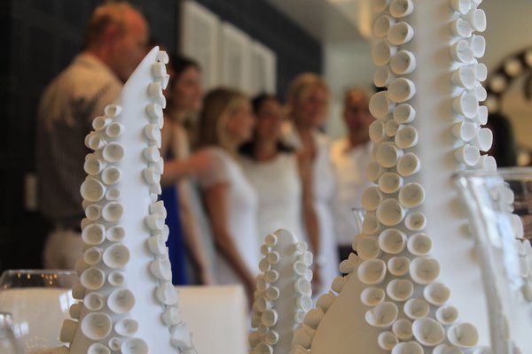 Ornate vases decorate a dining table inside a Ponquogue Point condo that was opened to the public on Friday, July 17. KYLE CAMPBELL