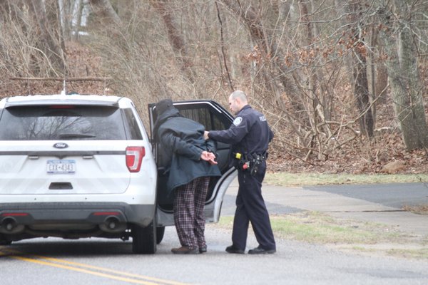 After an hourlong manhunt following reports of shots fired in an Oakview Highway home, East Hampton police officers apprehended a man nearby. Michael Wright