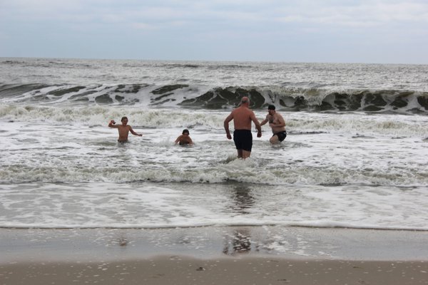 January 3: A small group of residents from Quogue and East Quogue continued the tradition of taking an icy dip in the Atlantic to mark the start of a new year at the Quogue Surf Club.