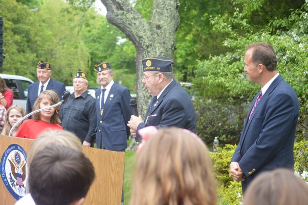 Members of Eastport American Legion Post 1545 address students as part of Friday's Memorial Day ceremony. From left: veterans