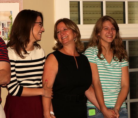June 26 -- Westhampton Beach Mayor-elect Maria Moore, center, smiles after learning that she had defeated Conrad Teller in the election. She is joined by her daughters, Elizabeth and Jackie.