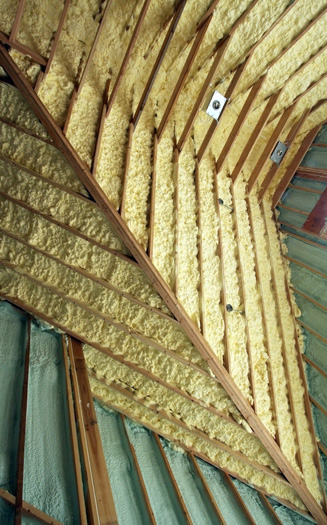 Spraying open-cell foam insulation into the home's envelope. PHOTO COURTESY STANLEY DALENE
