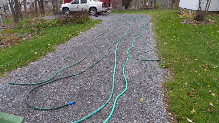 Before being stored, hoses should be stretched to drain then coiled with the ends attached to keep curious mice from setting up house. ANDREW MESSSINGER