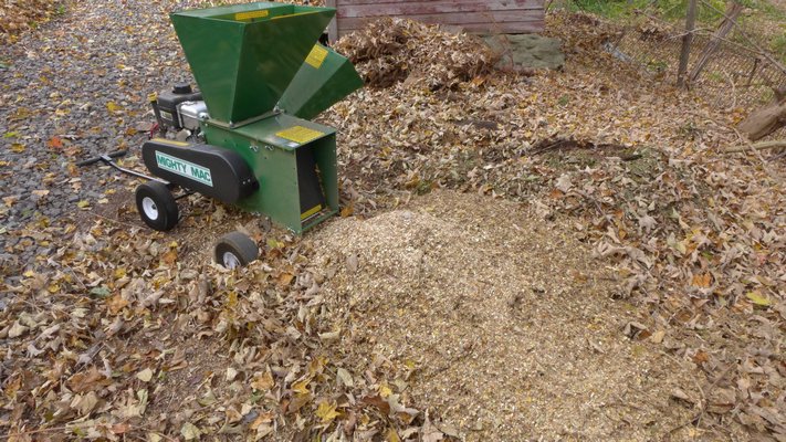 Looking at the business end of the chipper/shredder. After about 15 minutes the Mighty Mac has reduced several cubic yards of leaves to just about a bushel of shreds. ANDREW MESSINGER