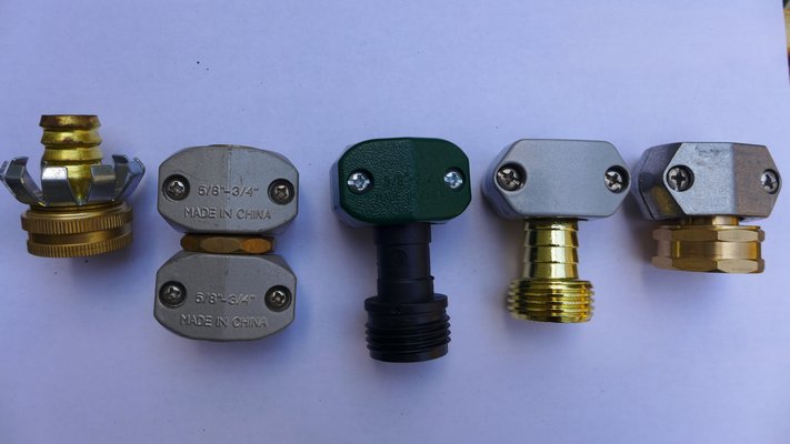 Hose repair kits in different styles and materials. Far left is a crimp style female end. This type is the most likely to fail. Second from left is a hose joiner that can join two pieces of a cut hose making it one again. Third from left is a plastic vice type repair end. Plastic will not withstand heavy ware or being driven over. The two at the far end are metal vice type male and female end repair parts. These will stand up to the most amount of abuse and last longest. ANDREW MESSINGER