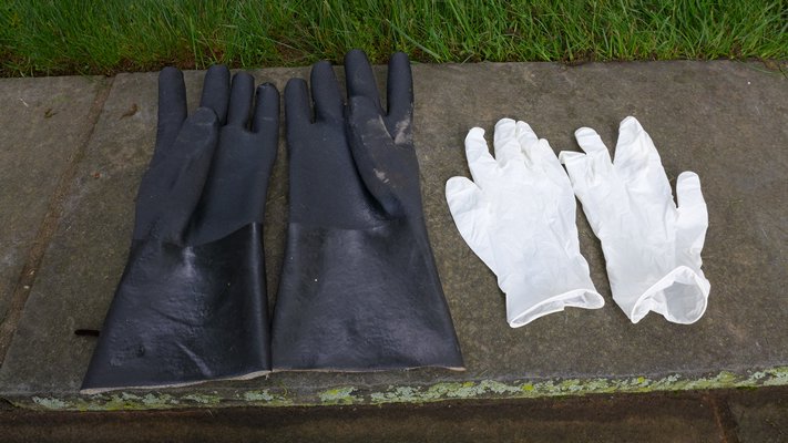Unlined rubber gloves, left, or 5 mil disposable latex gloves should always be worn when handling any kind of pesticides. This includes mixing, applying and cleaning equipment.  ANDREW MESSINGER
