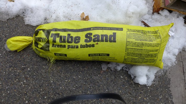 Tube sand is nothing more than sand in a tube. It tends to be very coarse which makes it great for traction on driveways and walkways without damaging plants or roots. ANDREW MESSINGER
