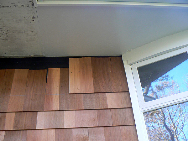 Uneven shingles on Helen and Jeff Dykeman's home during the first renovation. COURTESY DYKEMAN FAMILY