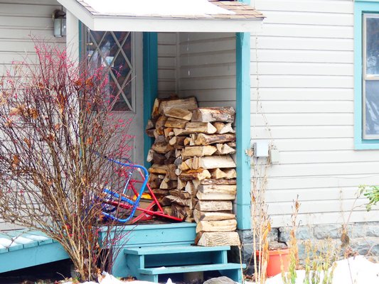 Wood stored by an access door makes life easy but storing wood like this for weeks or months can result in rodents nesting and wood -boring insects moving from the firewood to your house’s structural wood or siding. ANDREW MESSINGER