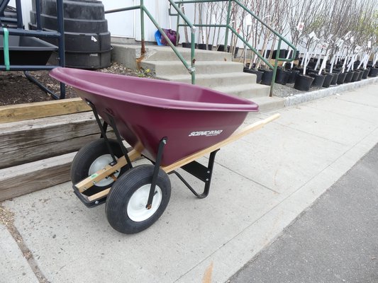 This dual-wheeled barrow can carry heavier and unwieldy loads as it’s better balanced. However, two wheels doesn’t make it any easier to lift the barrow only move it around. ANDREW MESSINGER