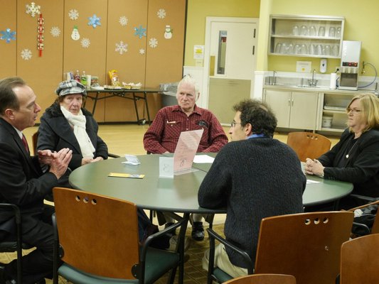 Walter Hoefer, clockwise from left, Florence and Robert Noll, Barnaby Friedman, and Dee Russell discuss energy efficiency during a seminar at the Hampton Bays Public Library. COURTESY GORDIAN RAACKE