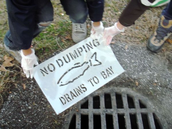 Students participate during the Springs School Stormwater Drain Stenciling Project. COURTESY JENNIFER SKILBRED