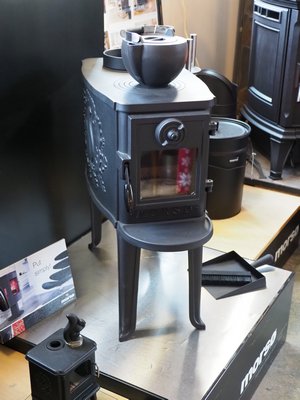 Wood stoves don’t have to be wide and fat. This front loading stove with a top griddle is designed for smaller spaces with tighter clearances. ANDREW MESSINGER