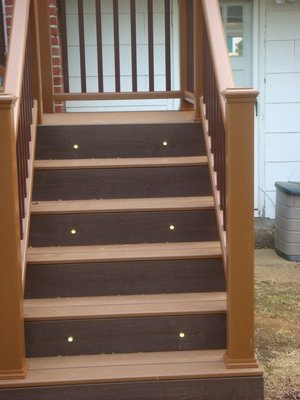 Stair and post lights help extend the life of a deck into the winter. COURTESY EZ-DECKS