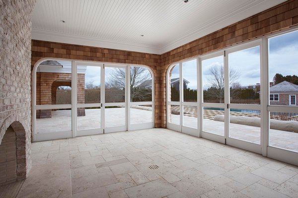 Porches, like this one by builder Jeffrey Colle, should be winterized by removing screens and replacing glass with storm windows. COURTESY MIDDLETON & GENDRON