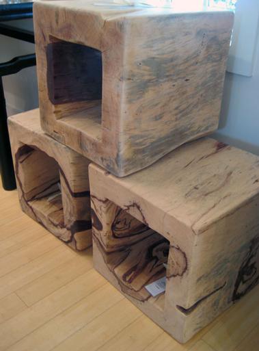 Blocky squares of exotic wood make side tables an immovable Belgian presence. MARSHALL WATSON