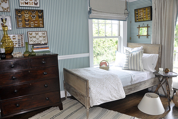 A bedroom by Tammy Connor Interior Design utilizes both vertical and horizontal stripes. MICHELLE TRAURING
