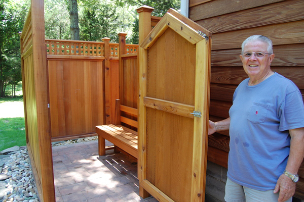 Frank Mezzacappa shows off  his son's outdoor shower in Springs.  Dawn Watson