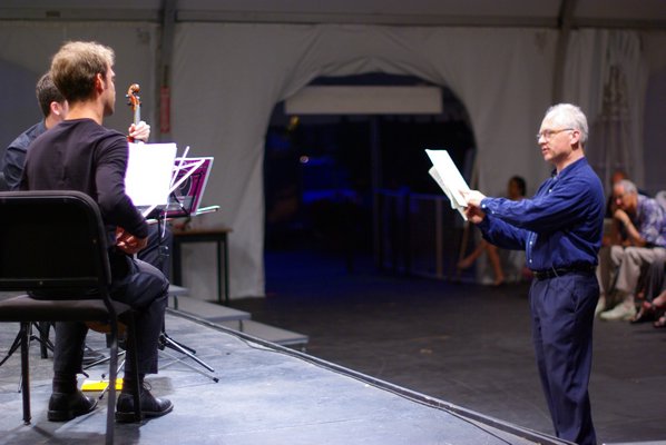 Chorus Master Patrick Romano warms up the PMP ensemble at the 2013 “Classical Collaborations” concert. SEAN LEE