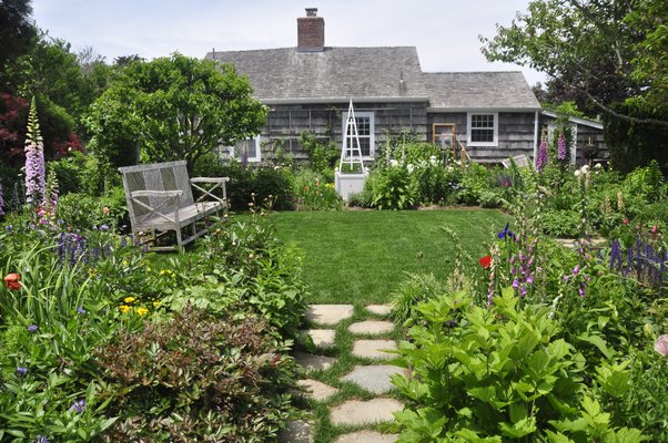 Scenes from Alexandra Munroe's and Robert Rosenkranz's garden in East Hampton. MICHELLE TRAURING