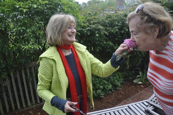 Helga Dawn, left, and Huguette Hersch talk roses. BY MICHELLE TRAURING