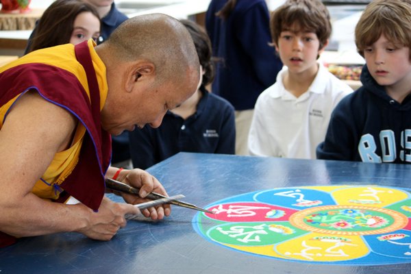 April 16 -- Tibetan monk Lama Tenzin demonstrates how to create a mandala with sand for Ross School students in April.