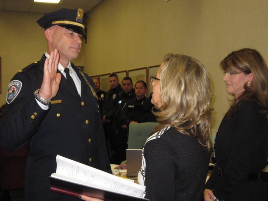 New Southampton Town Police Captain Lawrence Schurek was sworn in on Tuesday by Clerk Sundy Schermeyer as Supervisor Anna Throne-Holst looked on. M. Wright