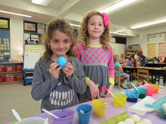 Sag Harbor Elementary School celebrated spring with a variety of projects recently. First-graders Cassidy Hisler and Leila Genender, right, colored eggs in their class.