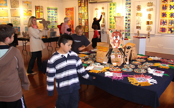 Students browse at the displays at the Springs School student art exhibit at Ashawagh Hall on Friday.