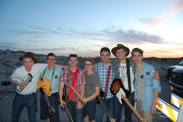 (Left to right) Keaton Comiskey (vocal/guitar/melodica), Sam Shaffery (mandolin), Patrick Connolly (saxophone), Nick Orientale (drums), Sam Basel (bass guitar), Connor Vaccariello (vocals/guitar), and Dimitris Niflis (piano) of folk-rock band The Subterraneans after their set. JON WINKLER