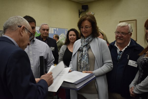 Members of the East Quogue Village Exploratory Committee met with Southampton Town Supervisor Jay Schneiderman on Wednesday to submit a completed petition for the incorporation of East Quogue. VALERIE GORDON