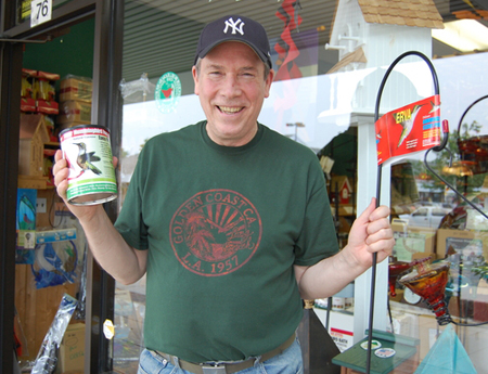 Michael Mackey, the manager of Wild Bird Crossing in Bridgehampton with hummingbird feed supplies.