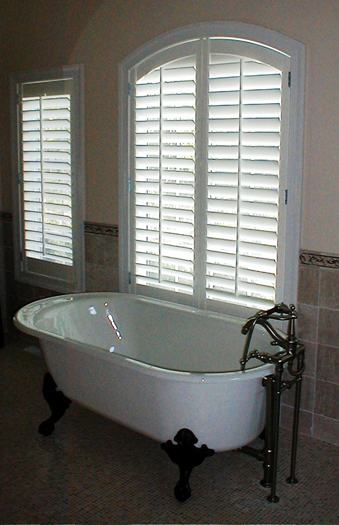 White wooden shades from Windows and Walls Unlimited in Southampton add a touch of traditional elegance. COURTESY WINDOWS AND WALLS UNLIMITED
