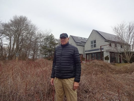 Steve Abramson outside his solar home in Water Mill. BRIDGET LEROY