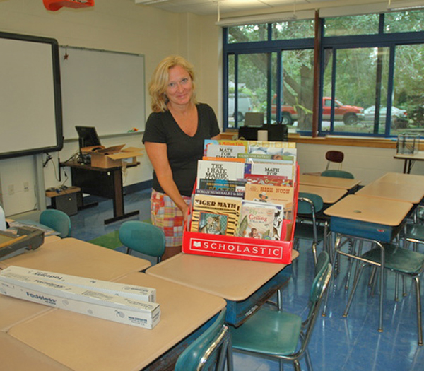 Linda Cameron, who has taught fifth grade for 21 years, sets up her new classroom at John Marshall Elementary School.