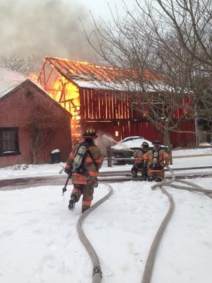 What was arguably the oldest standing barn in Southampton Village, located at 88 North Main Street, was destryoed in a fire on February 13. COURTESY SOUTHAMPTON FIRE DEPARTMENT
