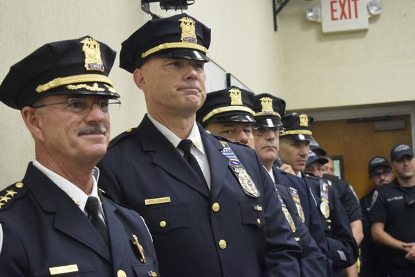 Southampton Police Chief Robert Pearce, retired as of September 30, with Interim Police Chief Lawrence Schurek and other members of the Southampton Police Department. JEN NEWMAN