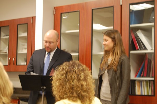 High School Principal Adam Fine introduces this year's valedictorian Carly Grossman to the school board at a meeting on March 18. Erica Thompson