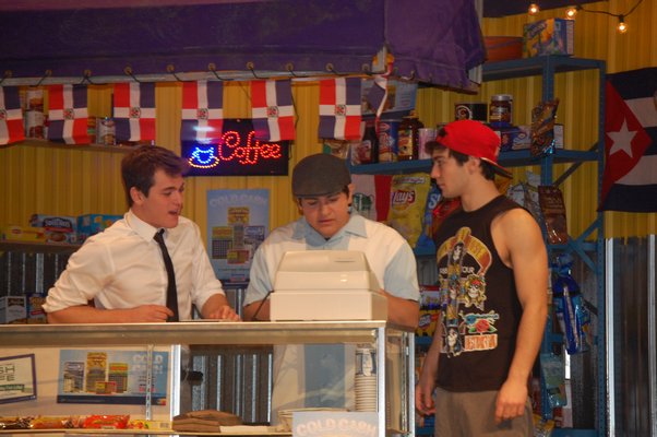 Brandon Diage, left, Alfredo Chavez, and Vincent Salsedo rehearsing a scene from "In the Heights" at the East Hampton High School. JON WINKLER