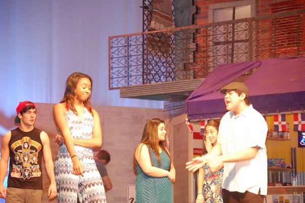 Vincenzo Salsedo, left, Ciara Bowen, and Alfredo Chavez rehearsing a scene from "In the Heights" at the East Hampton High School. JON WINKLER