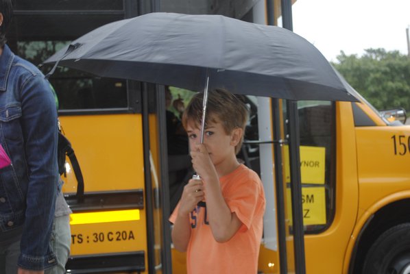 Darryn Green heads in to East Quogue Elementary School for his first day of first grade. AMANDA BERNOCCO