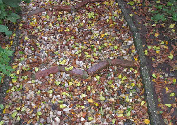 A path of pebbles and bricks at Madoo Conservancy.
