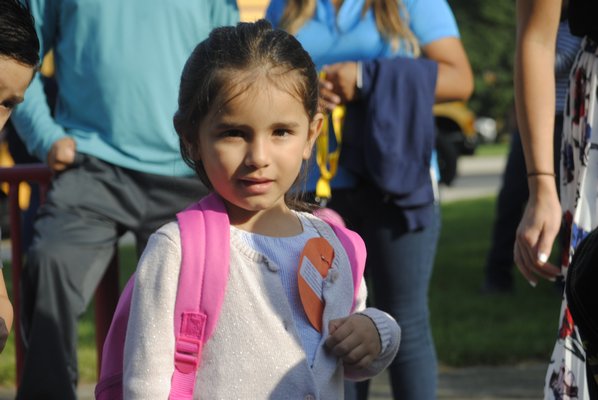 Jemely Mejia, a kindergartener at Hampton Bays Elementary, had her first day of school on Tuesday morning. AMANDA BERNOCCO