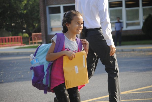 Yasmin Quijada Alvarenga, a third grader at Hampton Bays Elementary, went back to school on Tuesday morning. AMANDA BERNOCCO