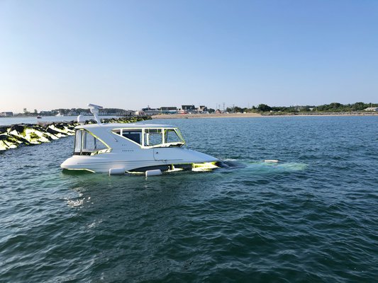 A 44 foot cabin cruiser struck a jetty of the Montauk Harbor inlet on Thursday night and sank. Michael Wright