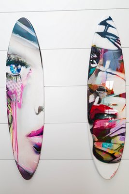 Two of eight surfboards designed by local artists sold during the silent auction. YVONNE TNT/BFA
