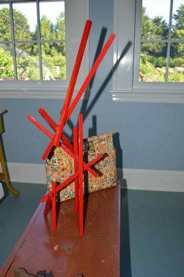 A Vaiasuso sculpture maquette juxtaposed with a a $6 South African artisinal handbag made from gum wrappers. CHRIS ARNOLD